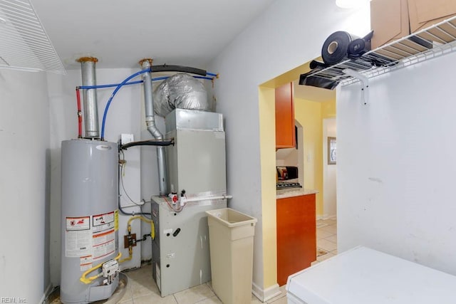 utility room featuring water heater