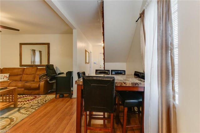 dining room with hardwood / wood-style floors and ceiling fan