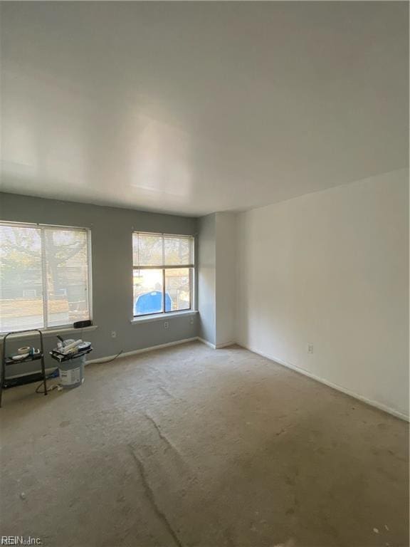 unfurnished living room with carpet floors