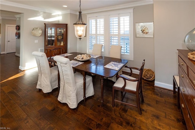 dining area featuring crown molding and dark hardwood / wood-style floors