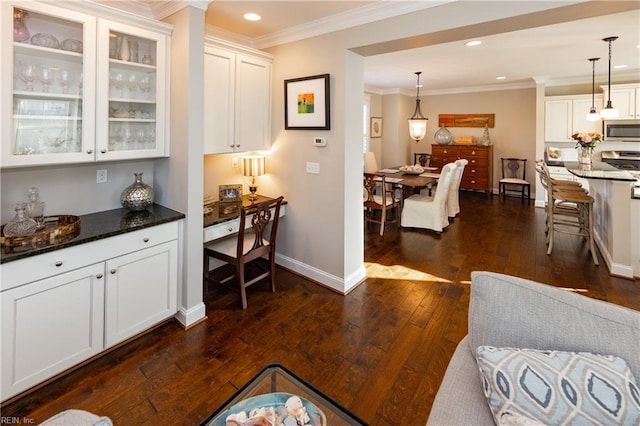 interior space featuring dark hardwood / wood-style flooring and crown molding