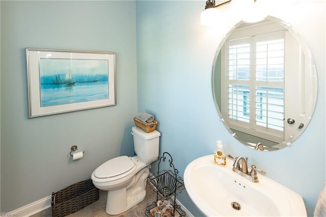 bathroom featuring toilet and sink