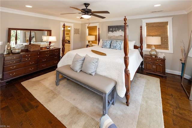 bedroom featuring crown molding, ceiling fan, dark hardwood / wood-style flooring, and ensuite bath