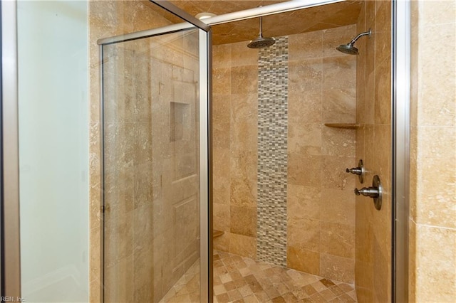 bathroom featuring a shower with door