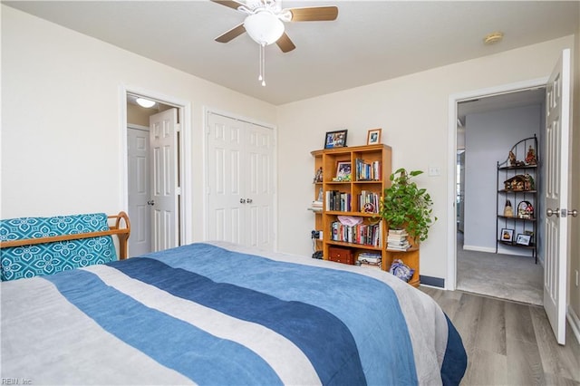 bedroom with wood-type flooring and ceiling fan