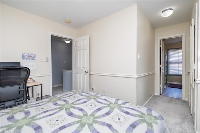 bedroom featuring light carpet