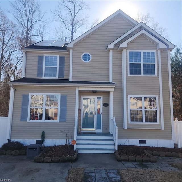 view of front of property with solar panels