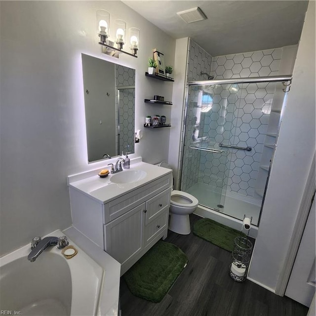 bathroom with vanity, wood-type flooring, toilet, and walk in shower