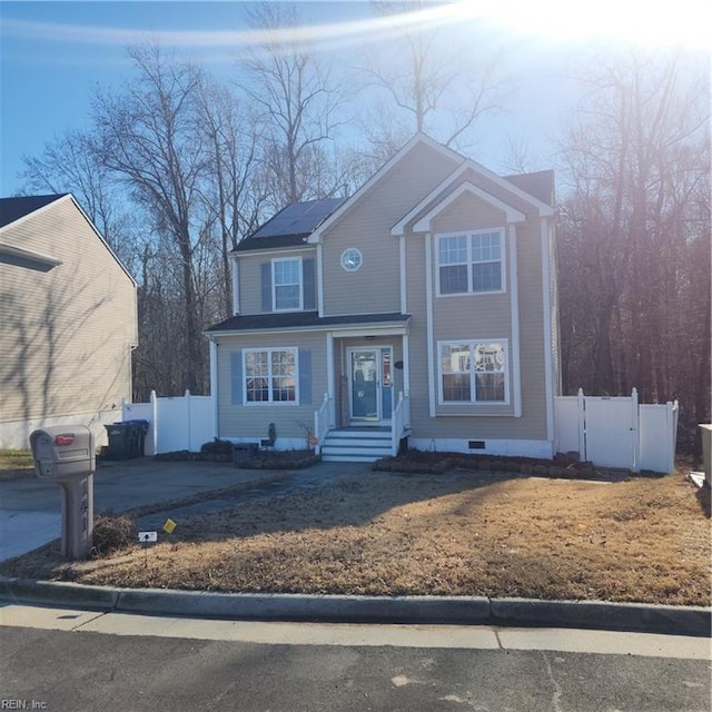 view of front of home featuring solar panels