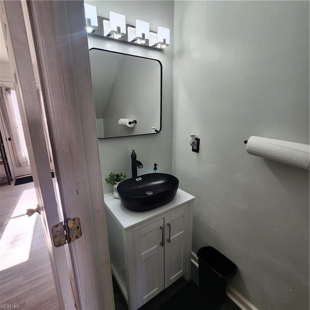 bathroom featuring vanity and wood-type flooring