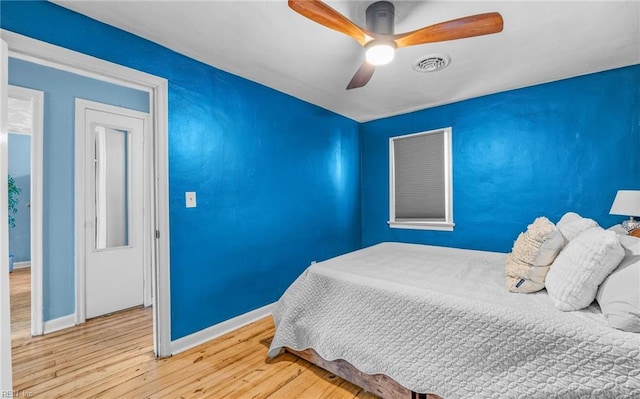 bedroom featuring hardwood / wood-style flooring and ceiling fan