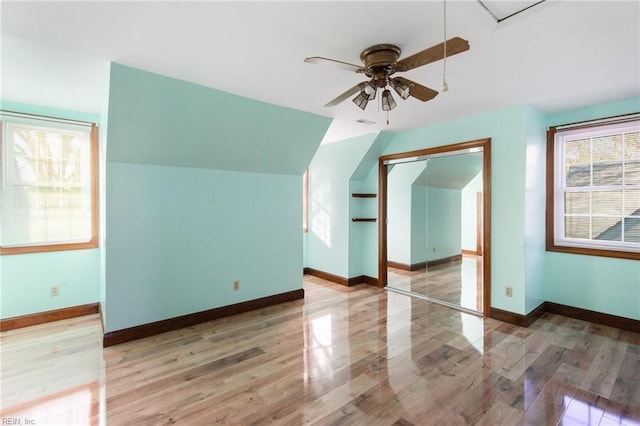 bonus room featuring ceiling fan, vaulted ceiling, and hardwood / wood-style floors