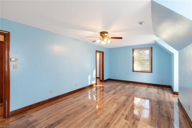 additional living space with vaulted ceiling, ceiling fan, and light hardwood / wood-style floors