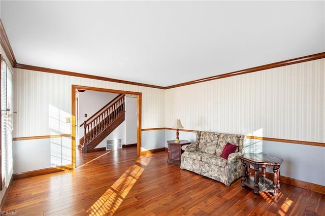 sitting room featuring crown molding and dark hardwood / wood-style floors