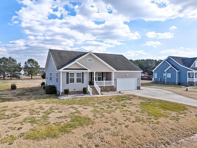 view of front facade featuring a garage and covered porch