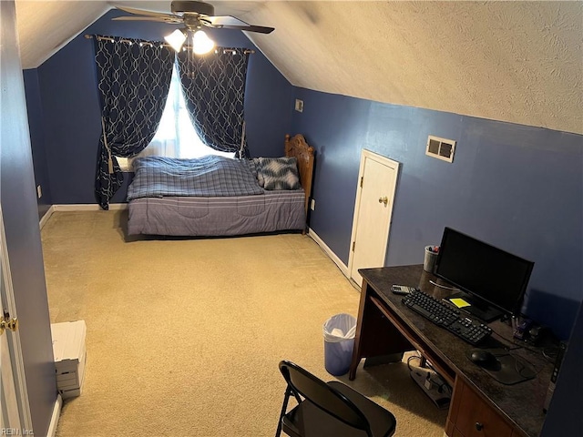 bedroom with ceiling fan, lofted ceiling, and light carpet