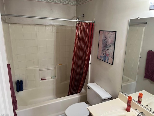 full bathroom featuring vanity, shower / tub combo, and toilet