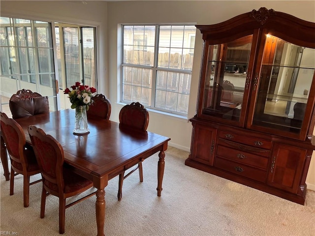 view of carpeted dining area