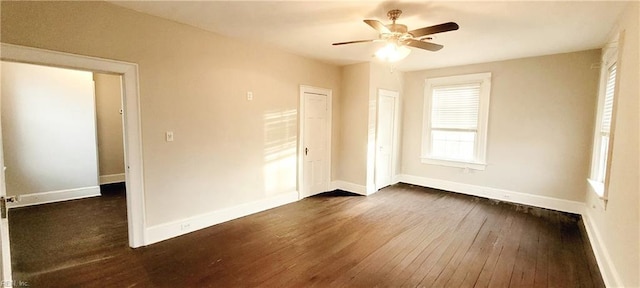 unfurnished bedroom featuring dark hardwood / wood-style flooring and ceiling fan