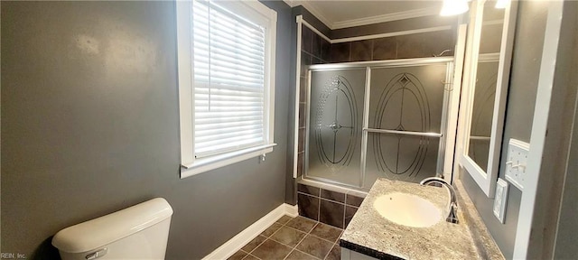 bathroom featuring crown molding, vanity, toilet, and tile patterned flooring