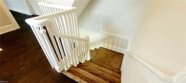 stairway with hardwood / wood-style floors