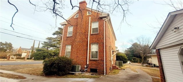 view of property exterior with central AC unit