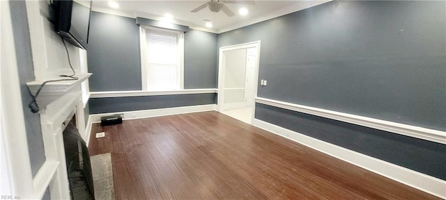 spare room with ceiling fan, ornamental molding, and hardwood / wood-style floors