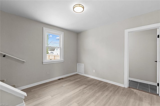 unfurnished room featuring light wood-type flooring