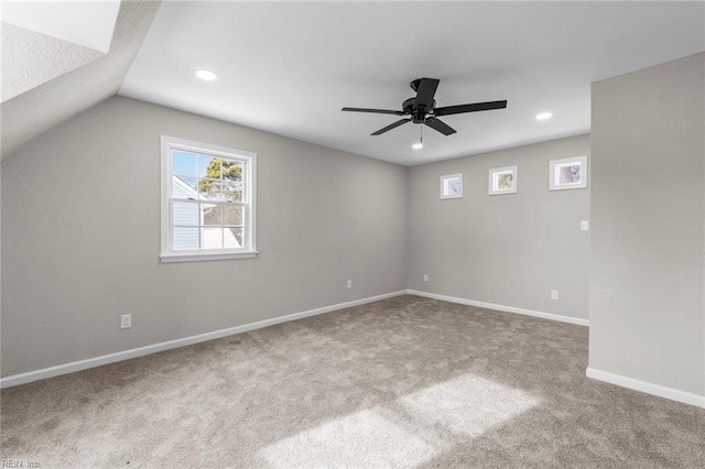 interior space featuring vaulted ceiling and ceiling fan