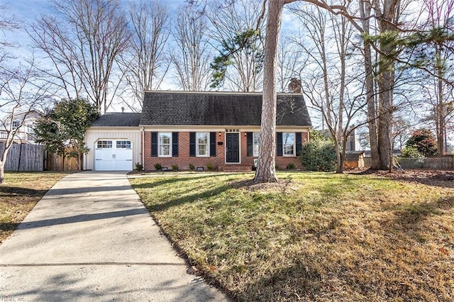 view of front facade with a garage and a front yard