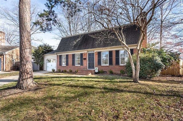 view of front of house featuring a garage and a front lawn