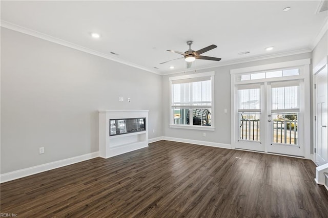 unfurnished living room with crown molding, ceiling fan, and dark wood-type flooring