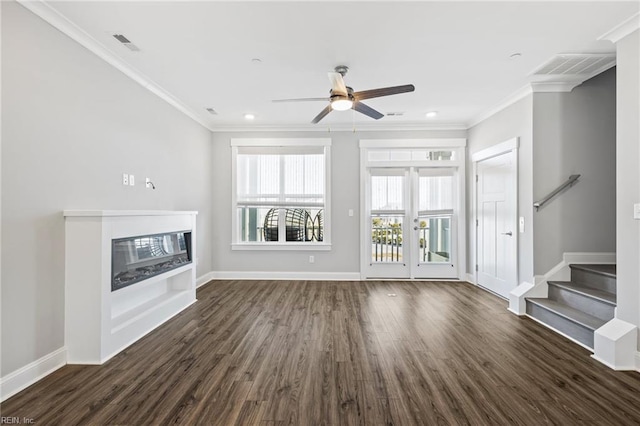 unfurnished living room with crown molding, ceiling fan, dark hardwood / wood-style flooring, and french doors