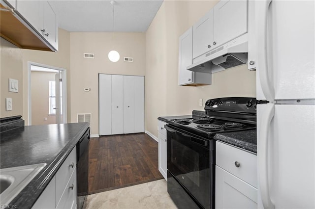 kitchen featuring sink, hardwood / wood-style flooring, hanging light fixtures, black appliances, and white cabinets