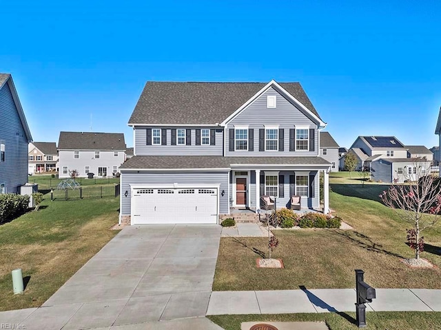 view of front of property with a garage, covered porch, and a front lawn