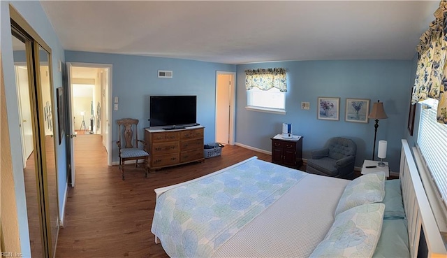 bedroom with hardwood / wood-style flooring