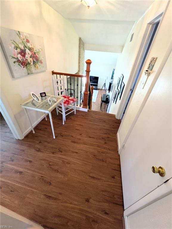 corridor with dark wood-type flooring