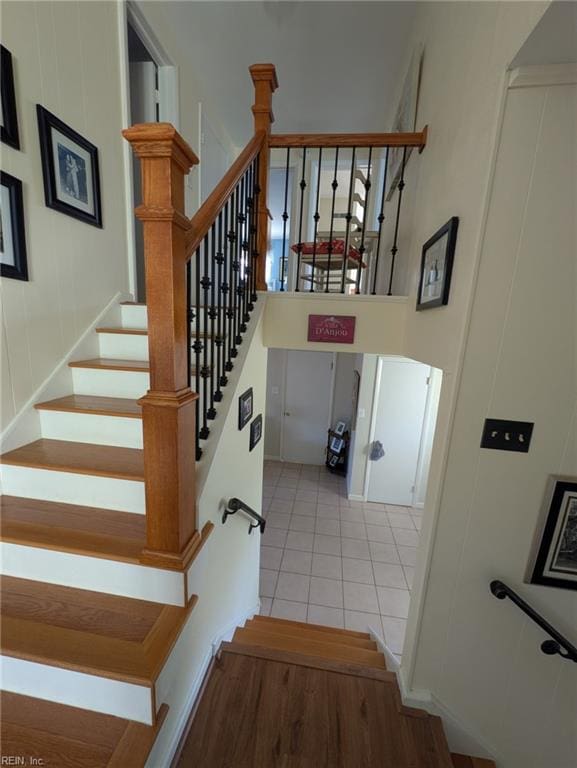 staircase featuring tile patterned floors