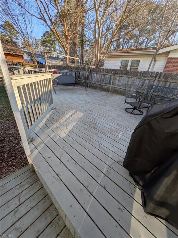 wooden deck with grilling area