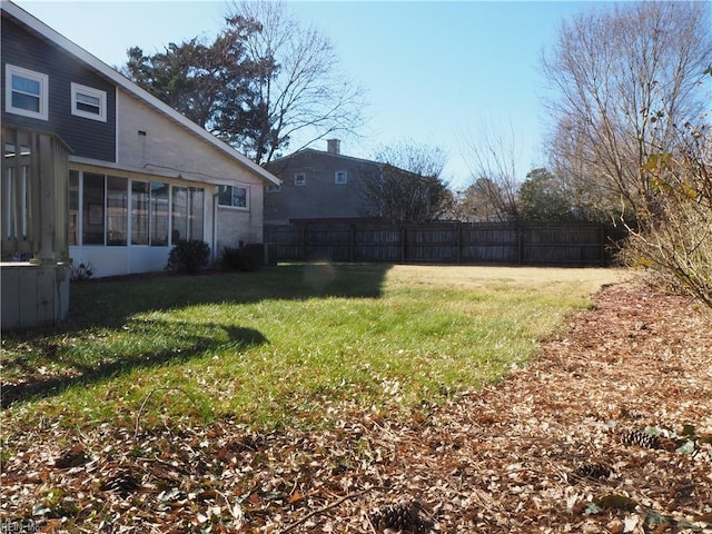 view of yard featuring a sunroom