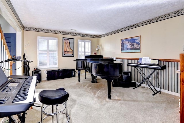 misc room with light colored carpet and a textured ceiling