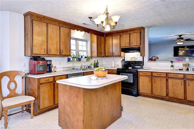 kitchen with decorative light fixtures, a center island, a textured ceiling, electric range, and stainless steel dishwasher