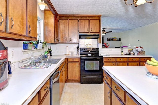 kitchen featuring sink, stainless steel dishwasher, electric range, and a textured ceiling