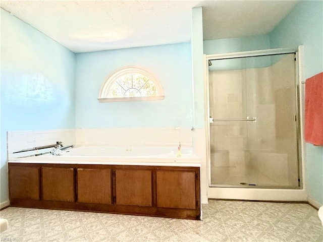 bathroom with separate shower and tub