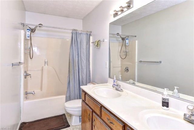 full bathroom with vanity, a textured ceiling, shower / bath combination with curtain, and toilet