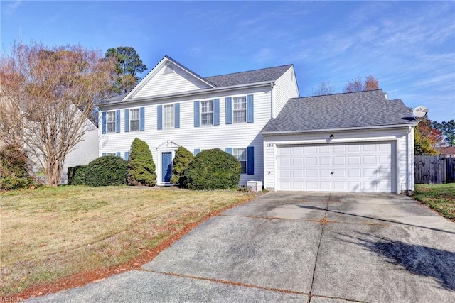 view of front of home with a garage and a front yard