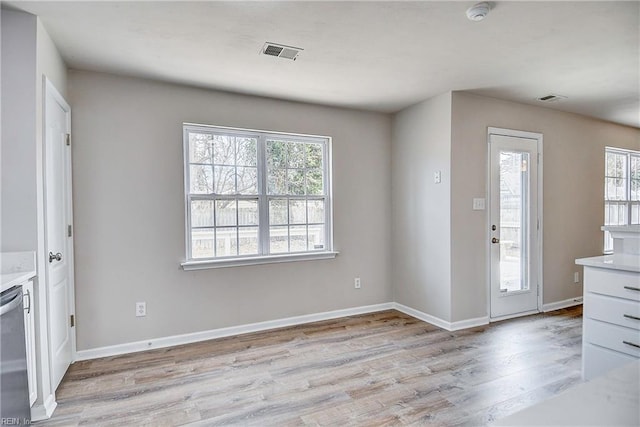 entrance foyer featuring a wealth of natural light and light wood-type flooring