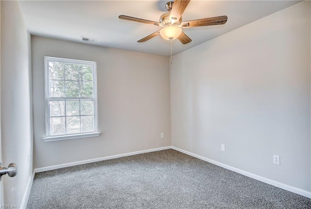 carpeted empty room featuring ceiling fan