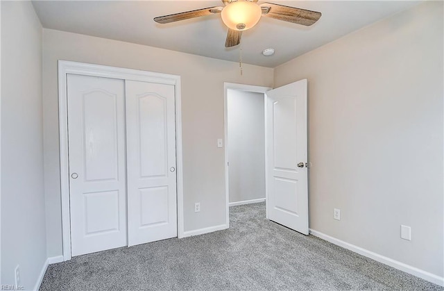 unfurnished bedroom featuring light carpet, a closet, and ceiling fan