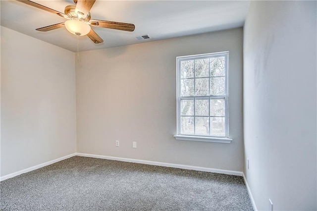 empty room featuring ceiling fan, a healthy amount of sunlight, and carpet flooring